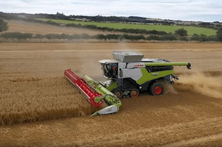 A combine harvester in Northumberland in action harvesting grain